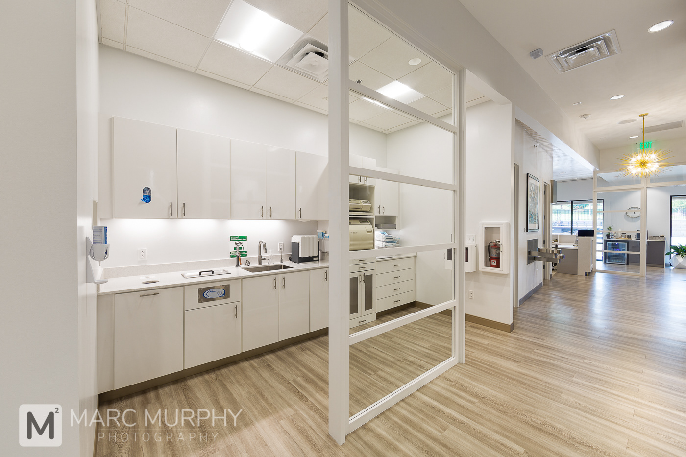 Sturgill Endodontics Office Sterilization Room and Hallway with Wood Floors and Beautiful Pendant Light Fixture