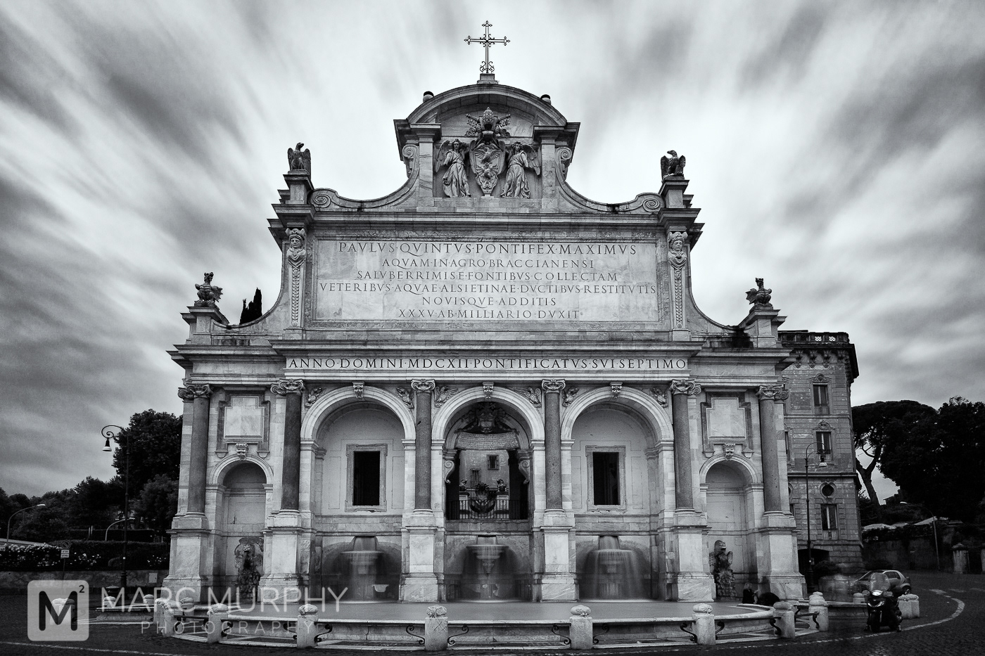Black and White Long-Exposure of Fontana dell'Acqua Paola Fountain in Rome Italy with Smooth Water and Moving Clouds