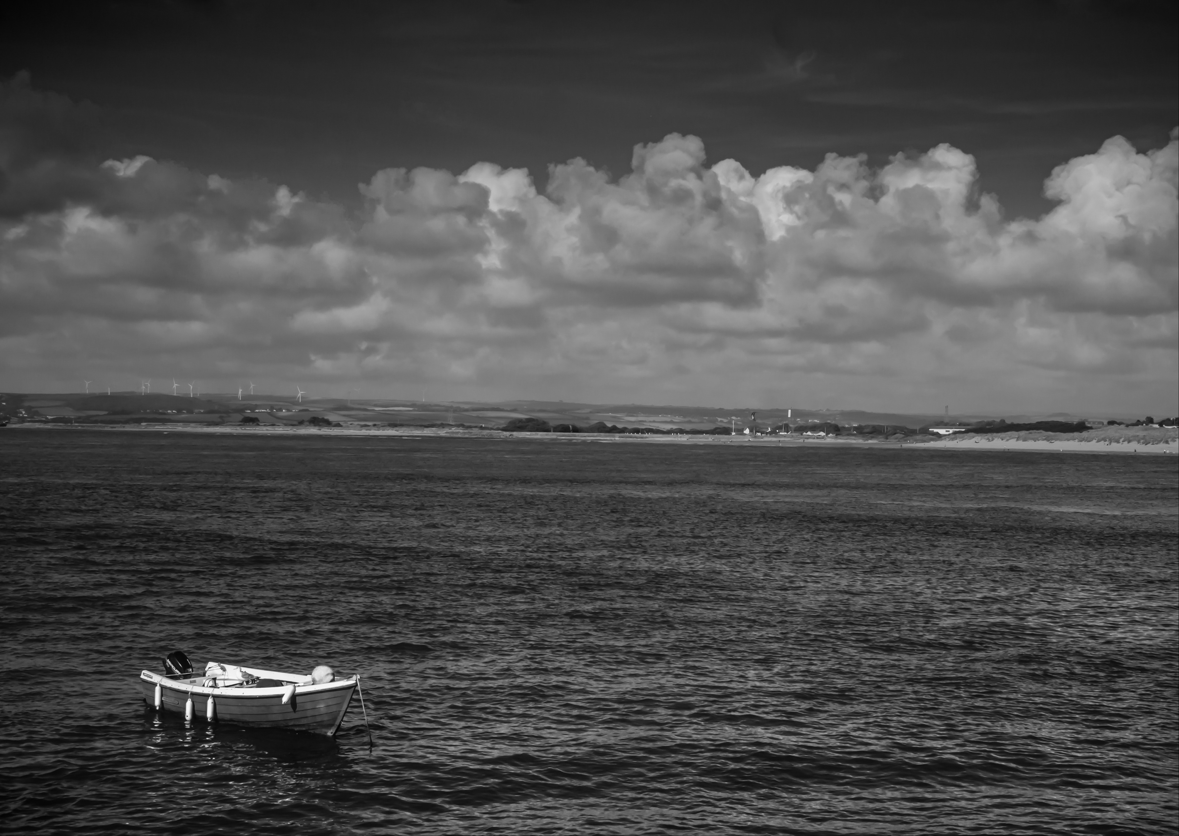 small boat on the water. black and white photograph