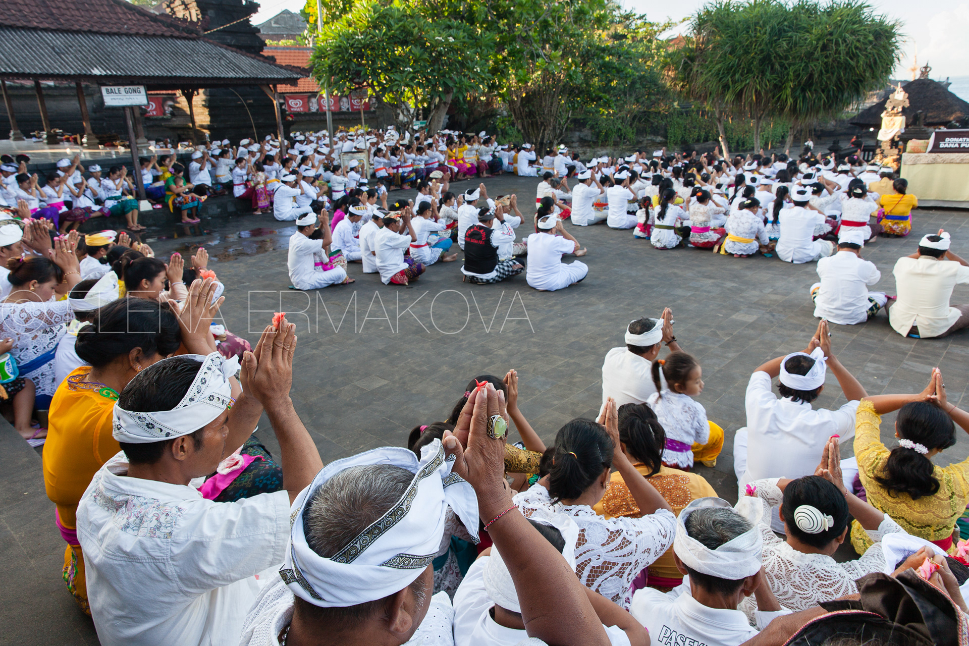 Balinese people pray during religious ceremony commemorated to Nyepi celebrations, Bali, Indonesia.