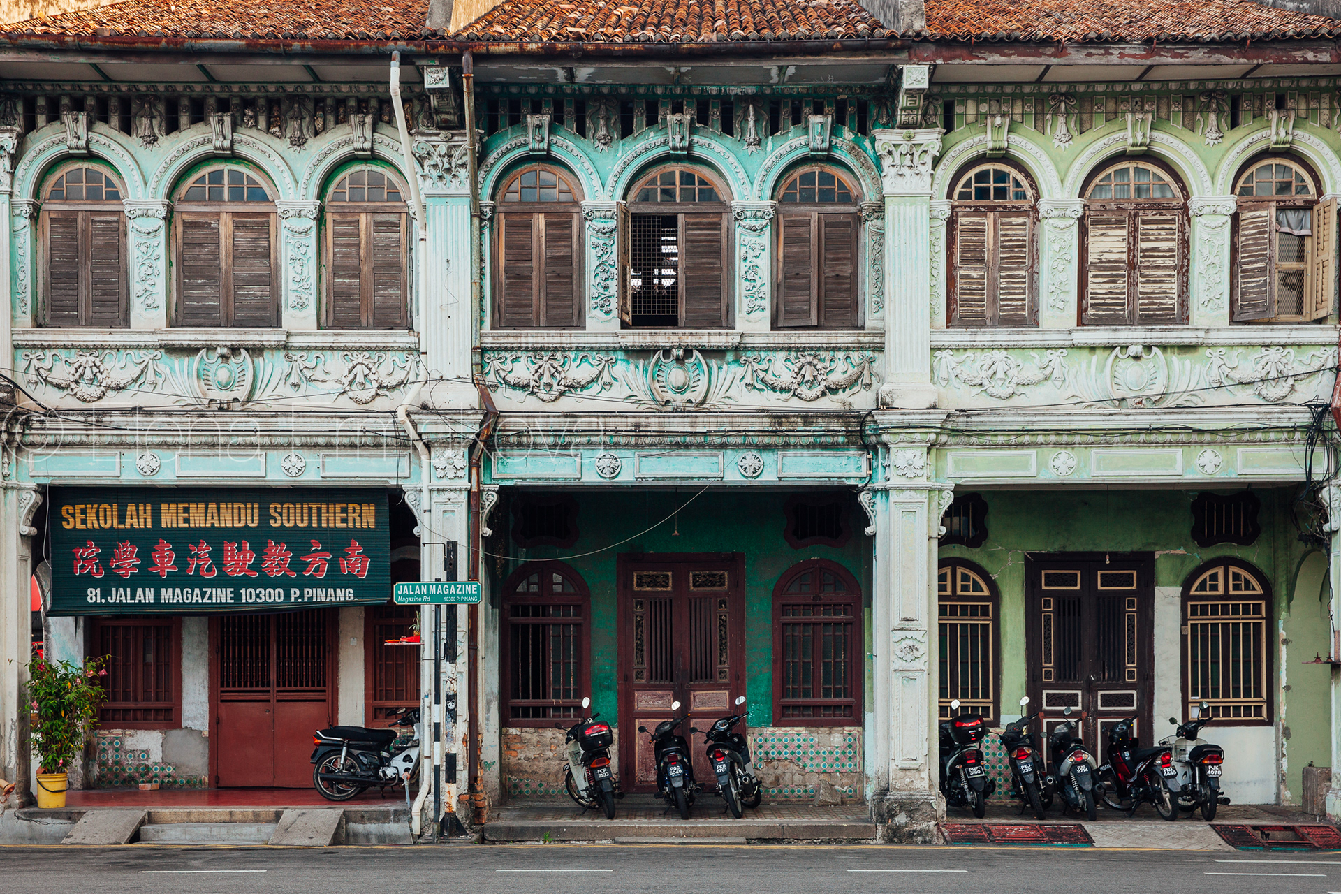 Facade of the old building located in UNESCO Heritage Buffer Zone, George Town, Penang, Malaysia. Travel photography by Elena Ermakova.