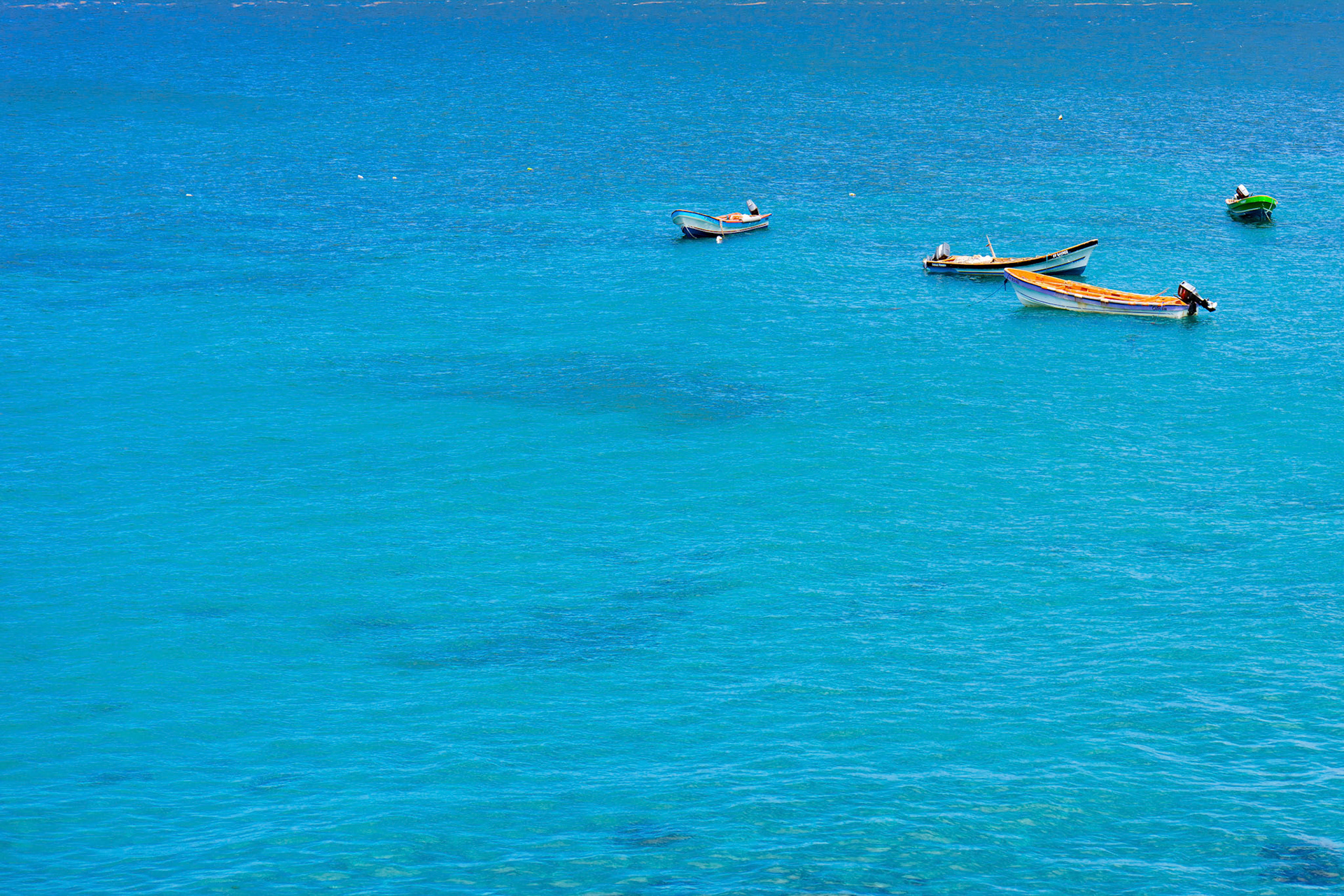 Tropical blue ocean and separated boats