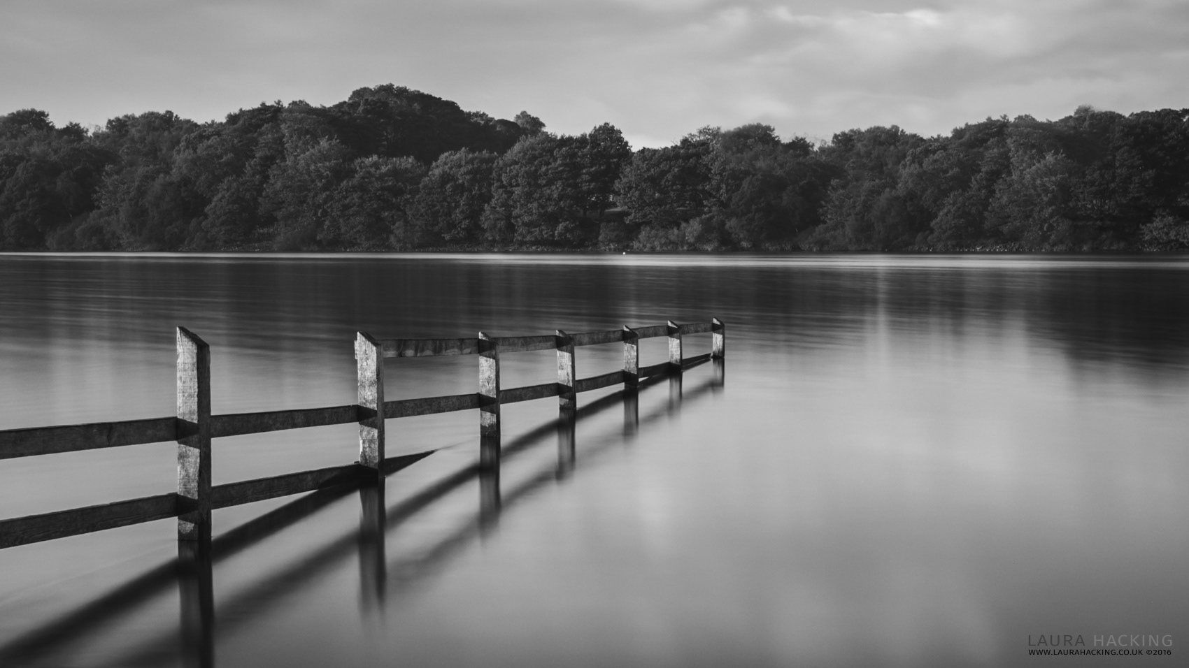 A fence at Rivington reservoir, Lancashire in black and white