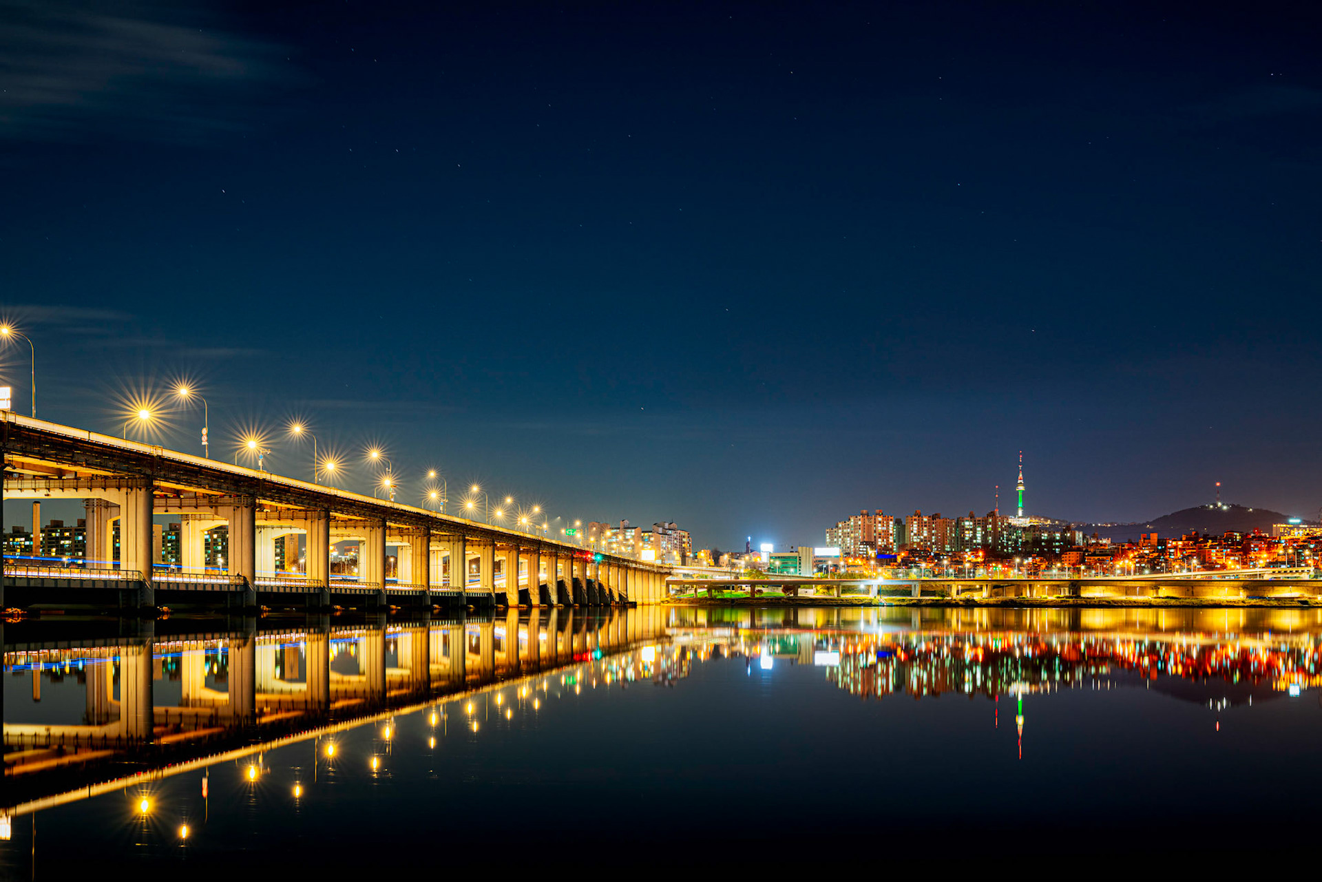 Seoul cityscape bridges, buildings and lights at night along the Han River