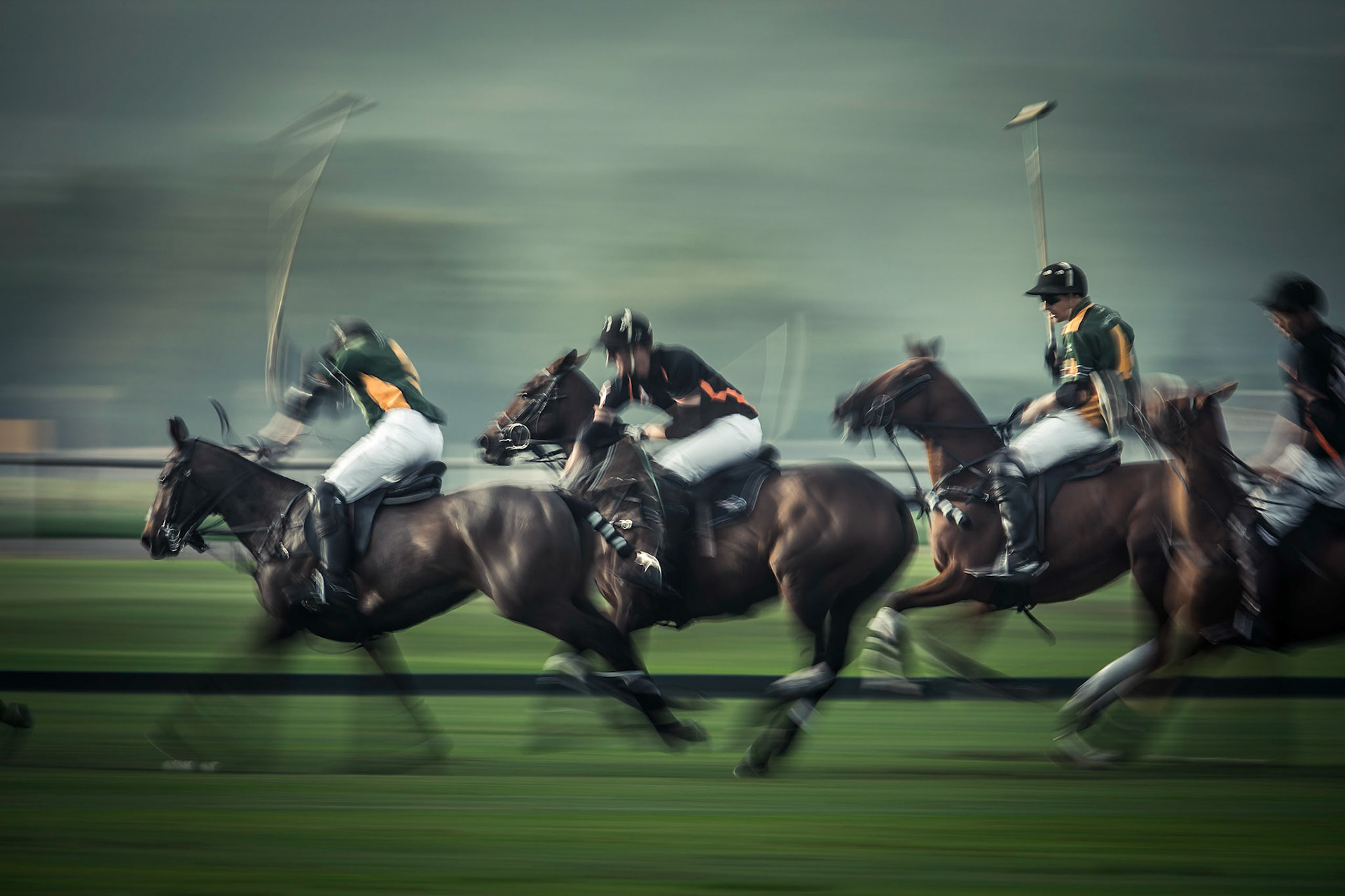 Polo players at speed