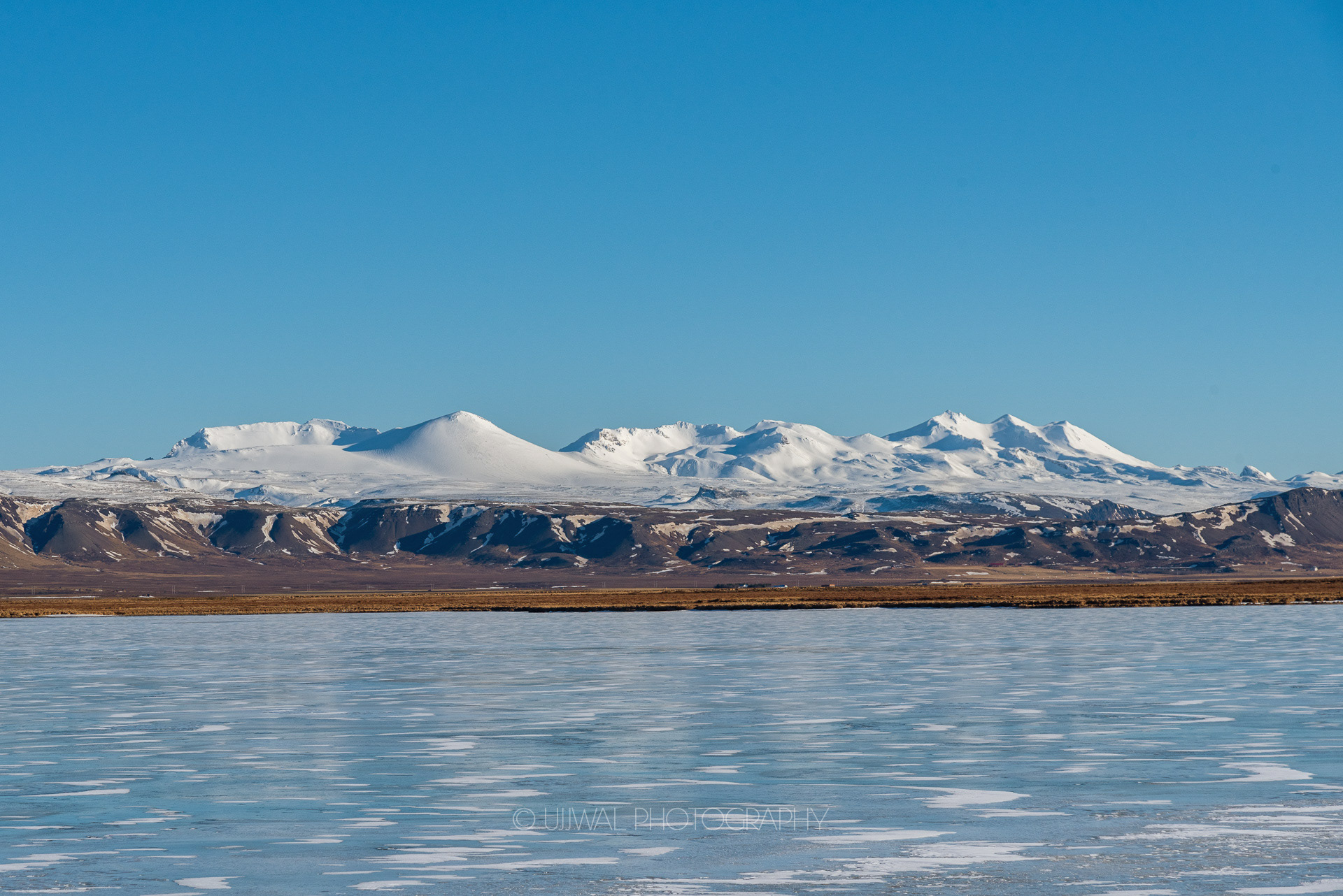 Snowcapped mountains along the hwy