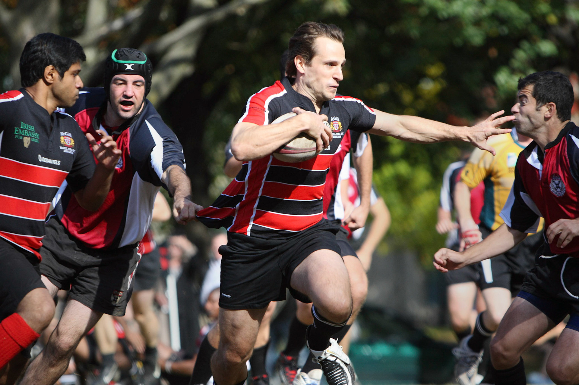 The McGill-Harvard rugby game is a yearly tradition between the schools' management faculties. Here, McGill’s Lukas Grinder makes a move.  October, 2008.
