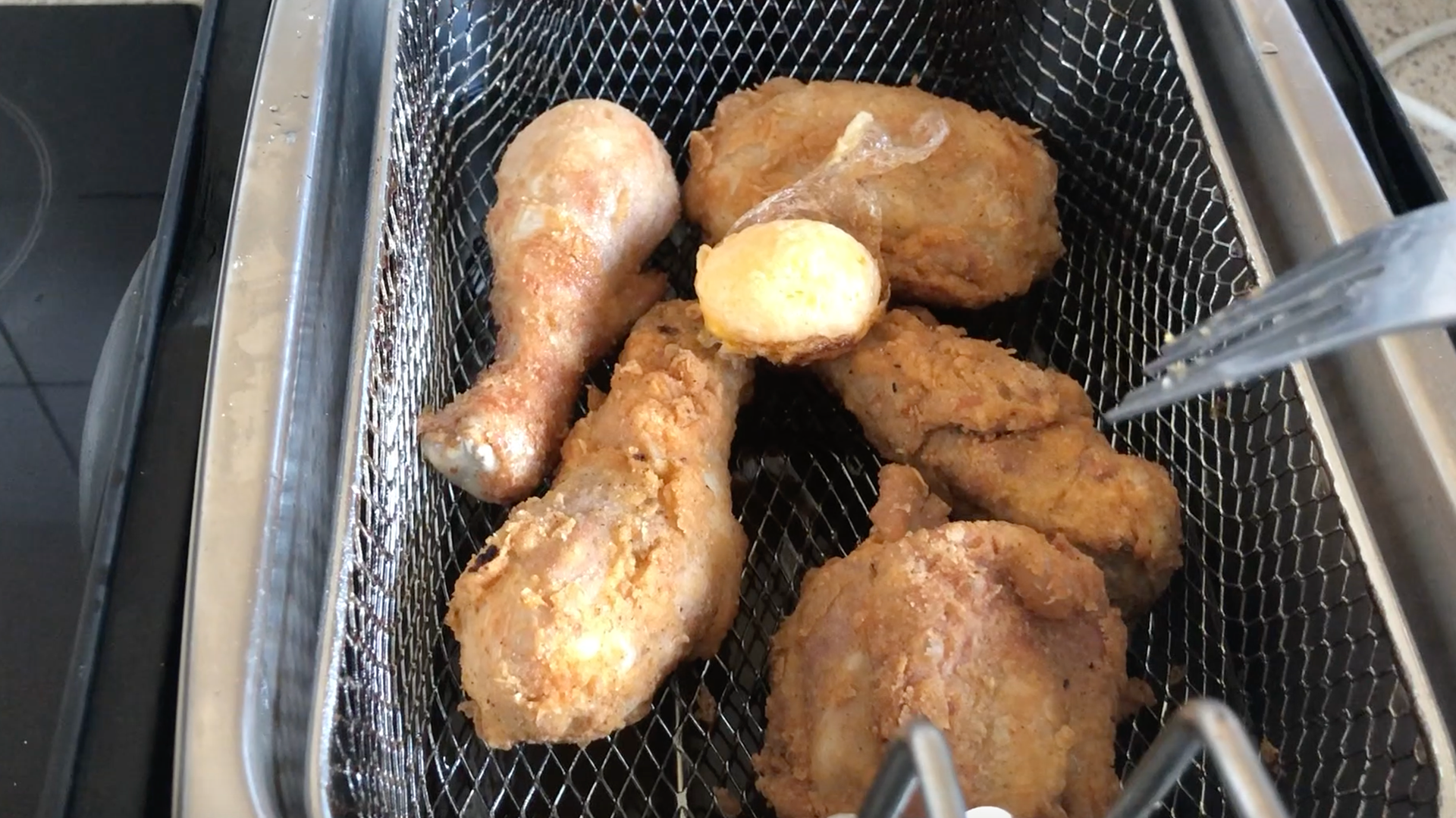 Fork Picking Medium Fried Chicken and Egg Yolk