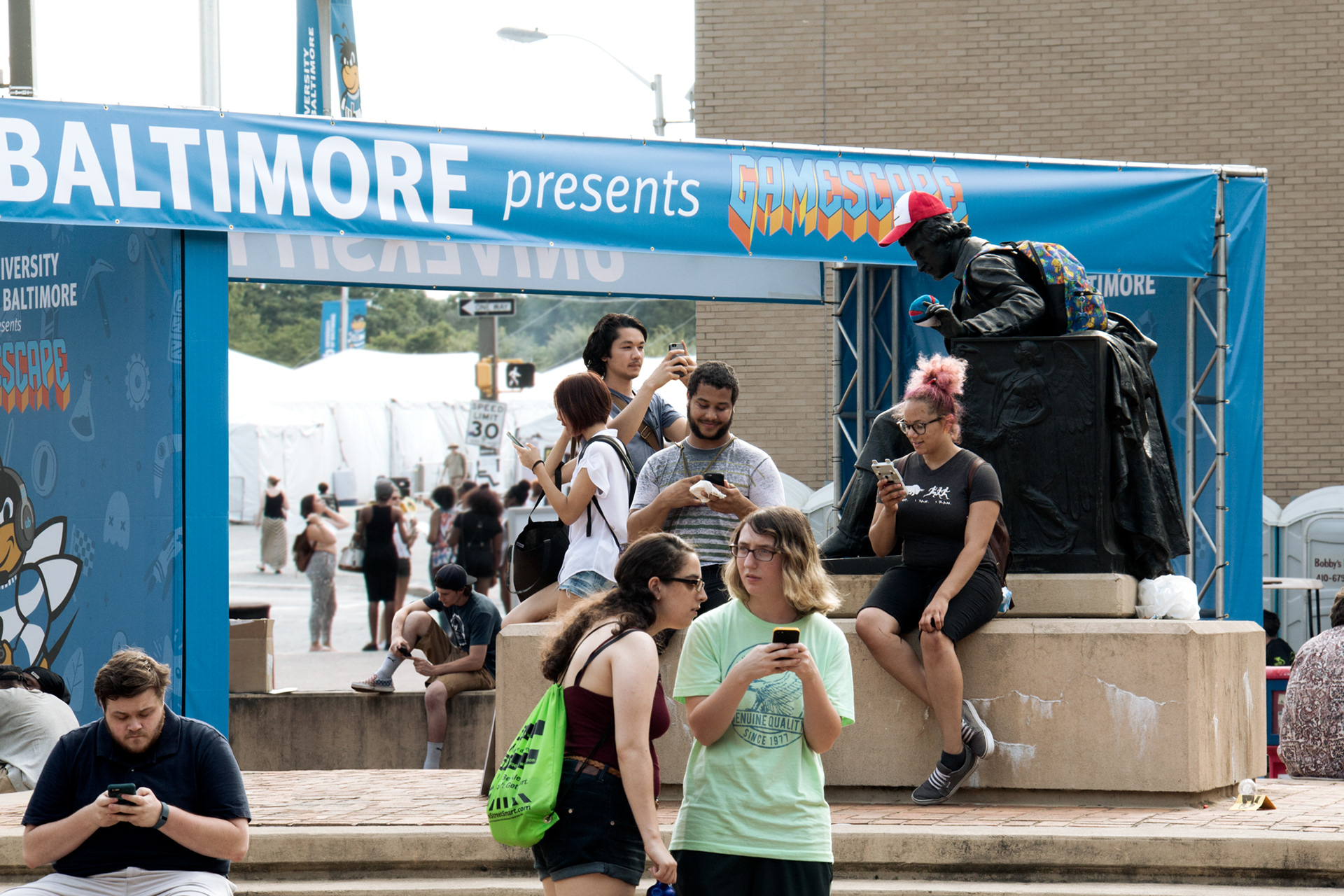 Emilee Beeson Gamescape social media PokemonGo stunt with crowd of people playing PokemonGo.
