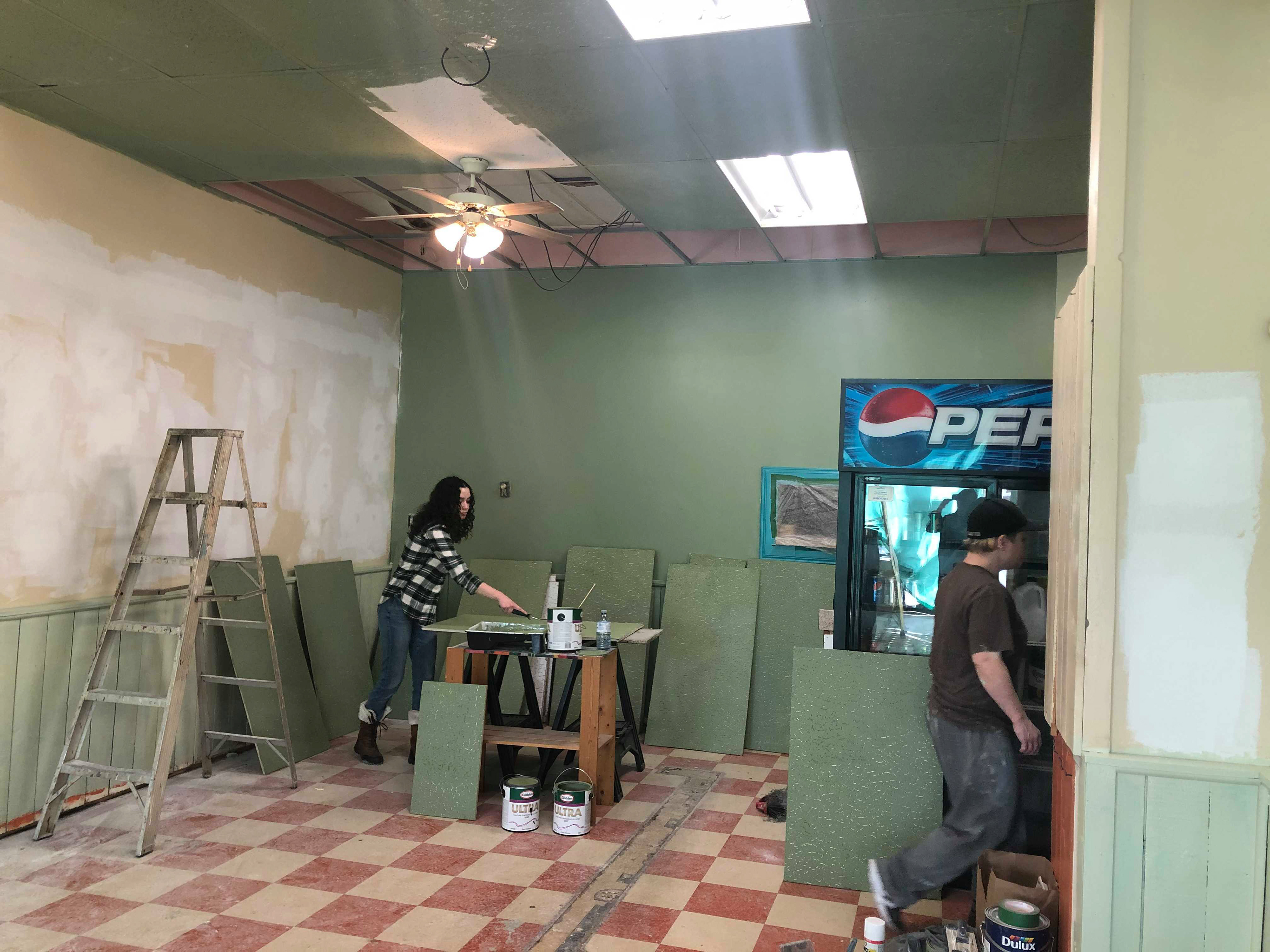 Painting ceiling tiles.
