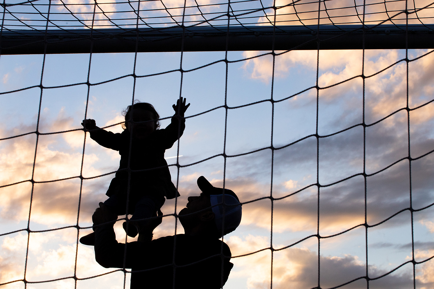 Northeastern men's soccer alumnus Matt Handy ('06) plays with his daughter, Josephine Handy, in the goal at halftime September 29, 2018 at Parsons Field. Northeastern soccer hosted "alumni night" and invited former players back out onto the field before the team narrowly defeated Elon 1-0 in overtime.