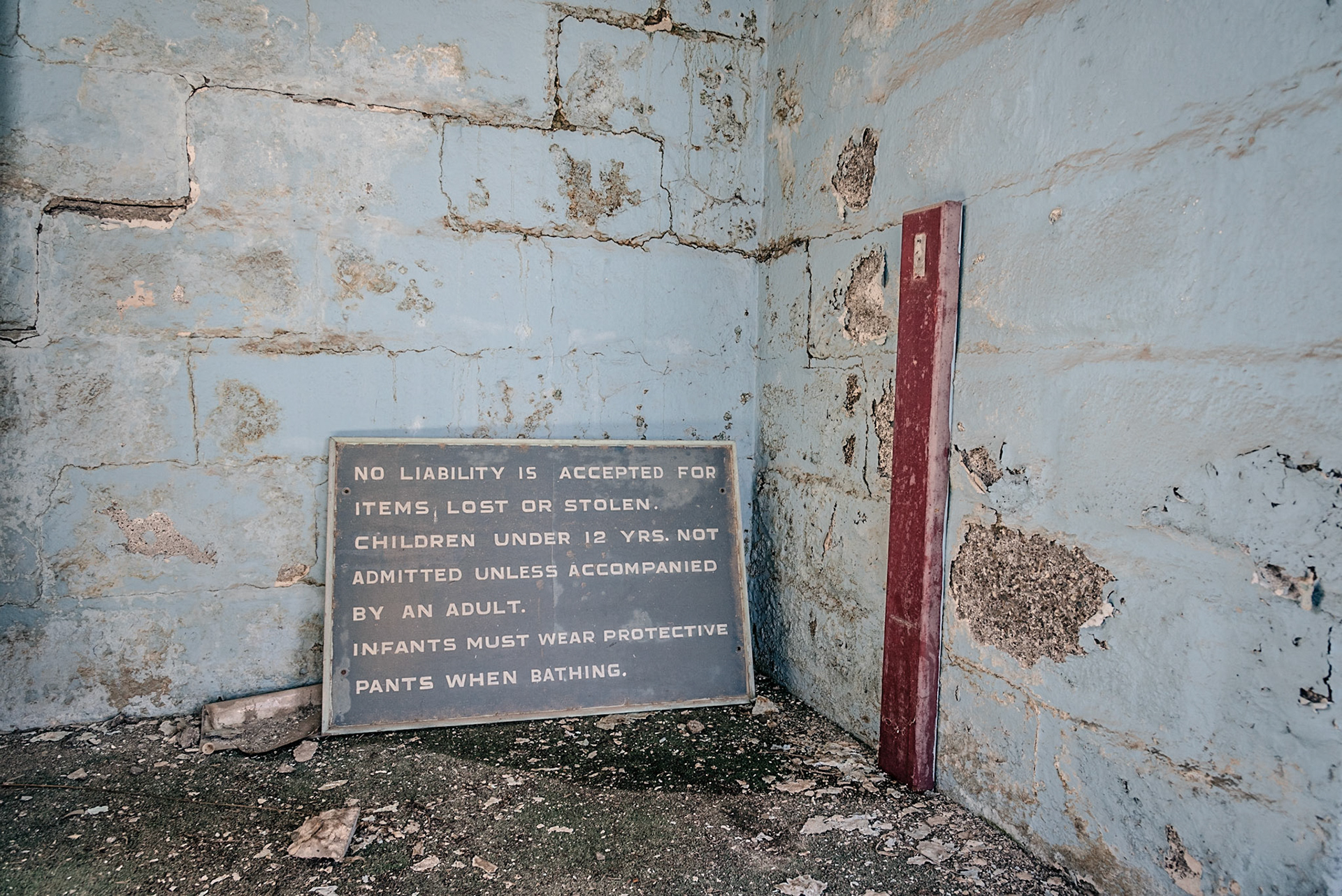 Sign in the swimming pool changing rooms at the abandoned Berengaria Village in Limassol, Cyprus