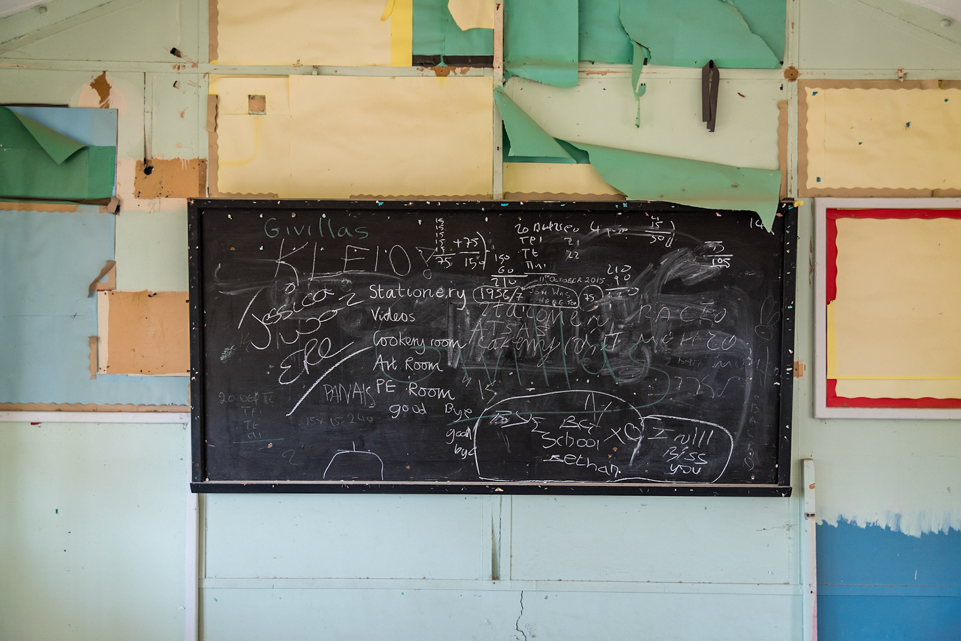 Chalkboard in an abandoned classrooms at Berengaria Village in Limassol, Cyprus. Wirtten on the board are farewell messages from the students.