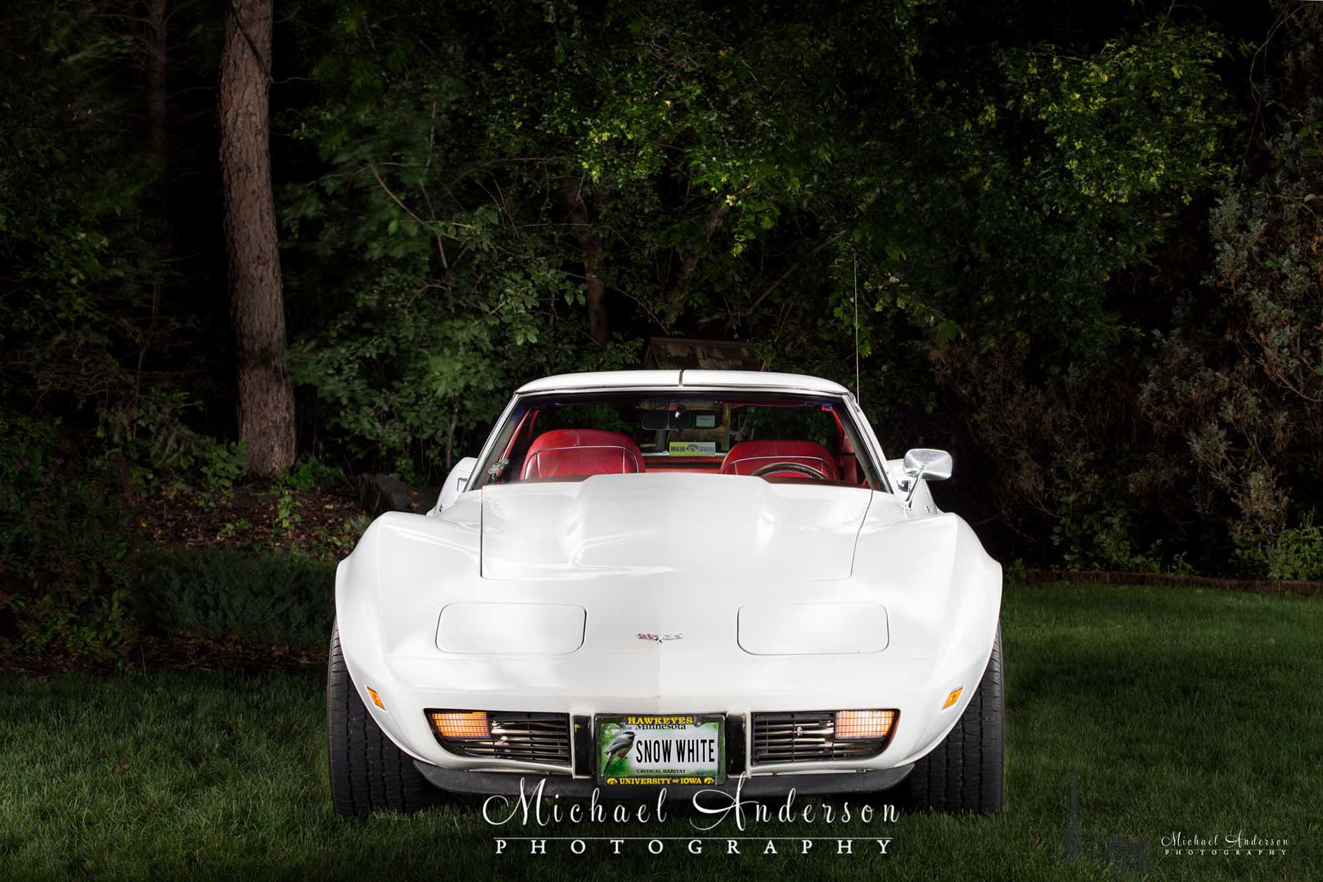 Light painted photo of the front of a white 1977 Corvette.