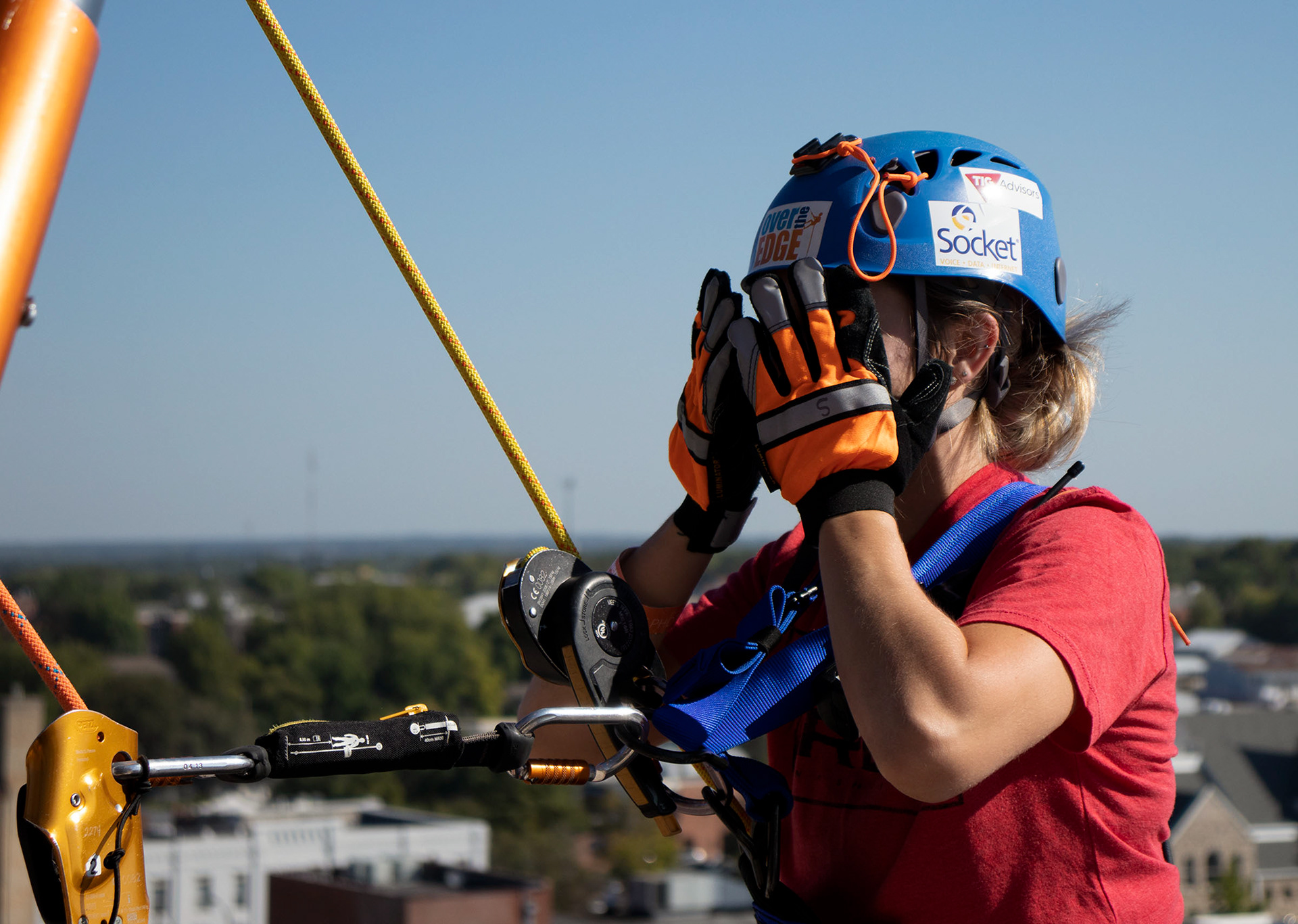 Catryna Craw, from the radio station Clear 99, looked down and said she wasn’t so sure about her decision. Volunteers on the roof said she couldn’t turn back now because she was already hanging off the ledge. Rappellers had to raise $1,000 to climb down the Tiger Hotel.
