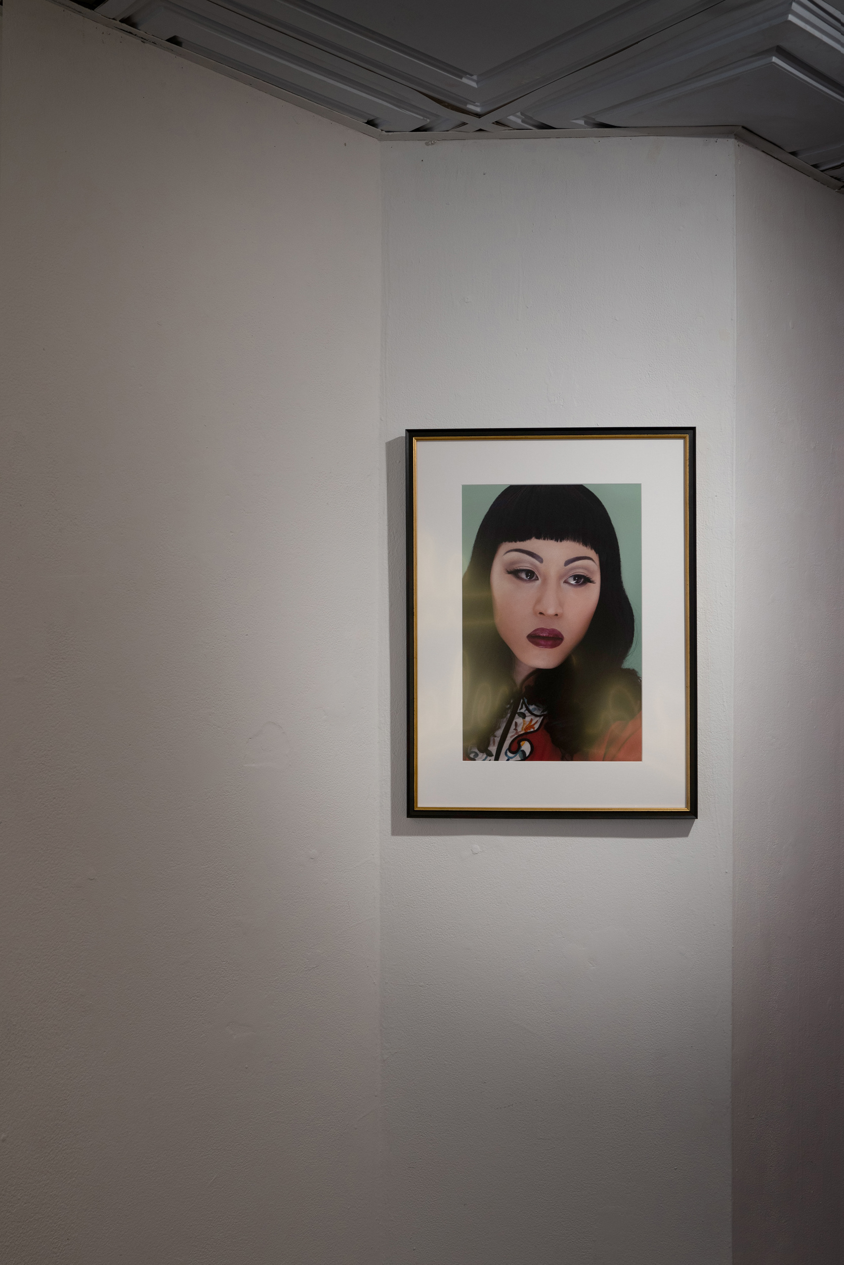 A photograph of a glamorous Asian drag performer