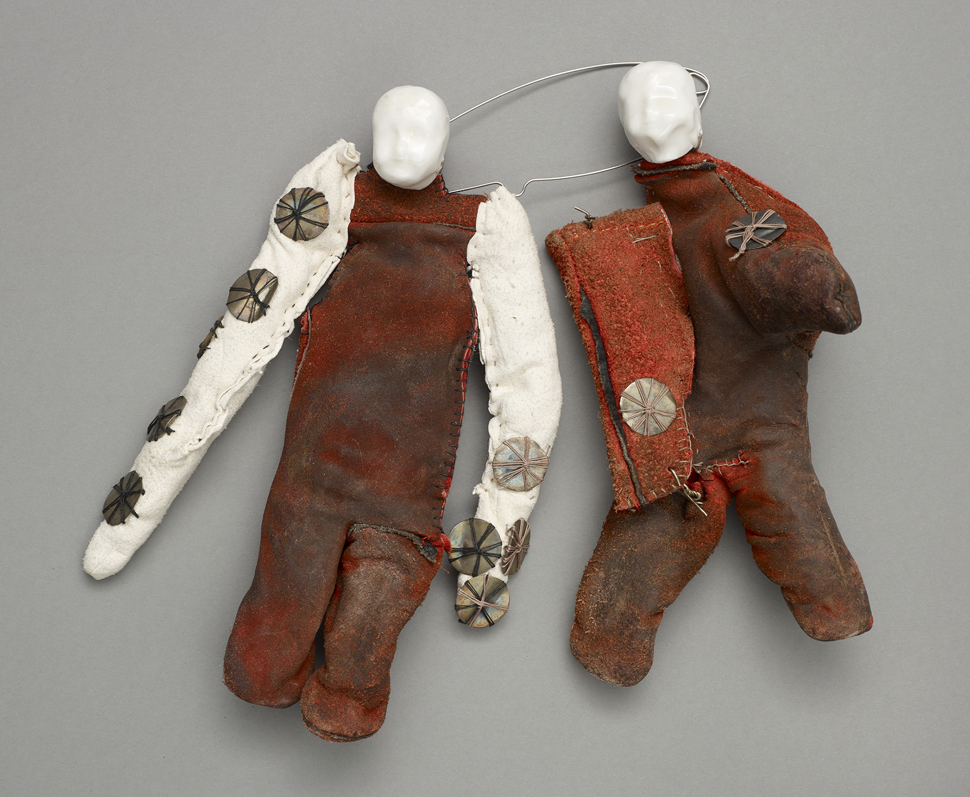 No. 3 Item: Brooch H 25cm W 21cm D 4cm Materials: reclaimed leather from gloves, porcelain, found silver coin love tokens, thread, silver, stainless-steel Photo credit: Michael Pollard