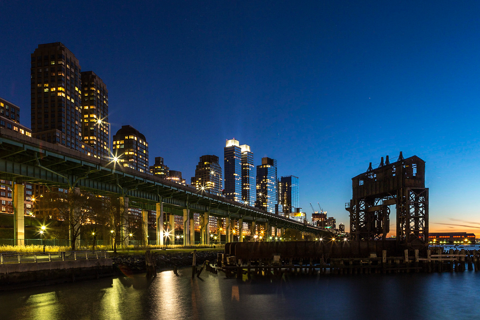 The 69th Street Transfer Bridge with the Upper West Side skyline at twilight