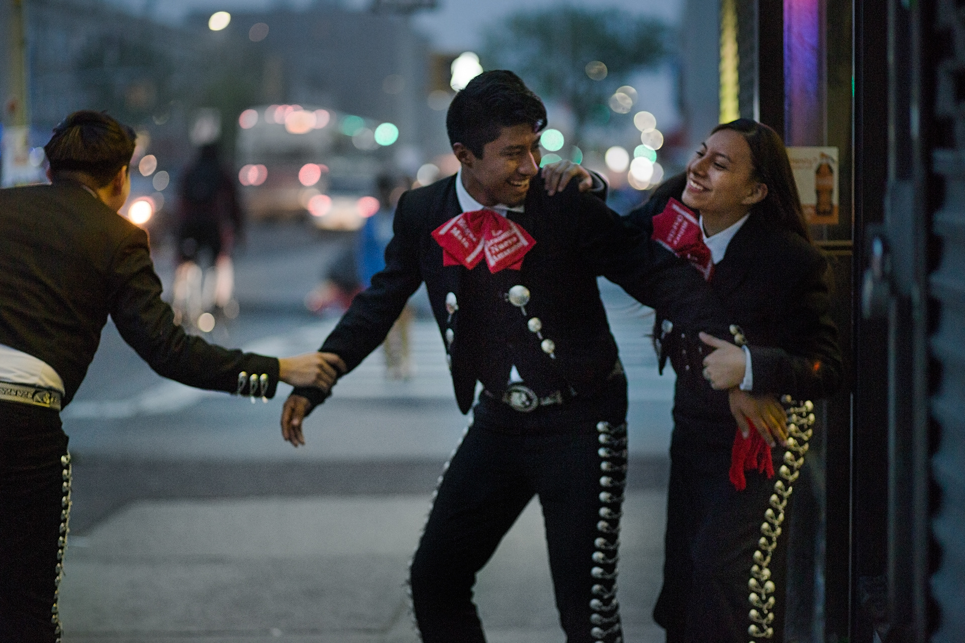 From left, Jonathan Alquicer, 19, Edgar Mata, 16 and Hillary Garcia, 14, playing outside a Chinese restaurant in Queens. April 2017.