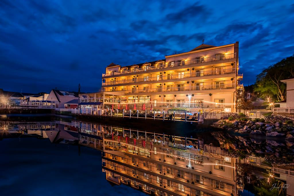 Mackinac Island at night, Chippewa Hotel and Pink Pony waterfront with reflection