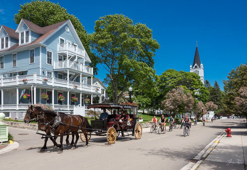 Mackinac Island, horse & carriage on Main Street has that small town look