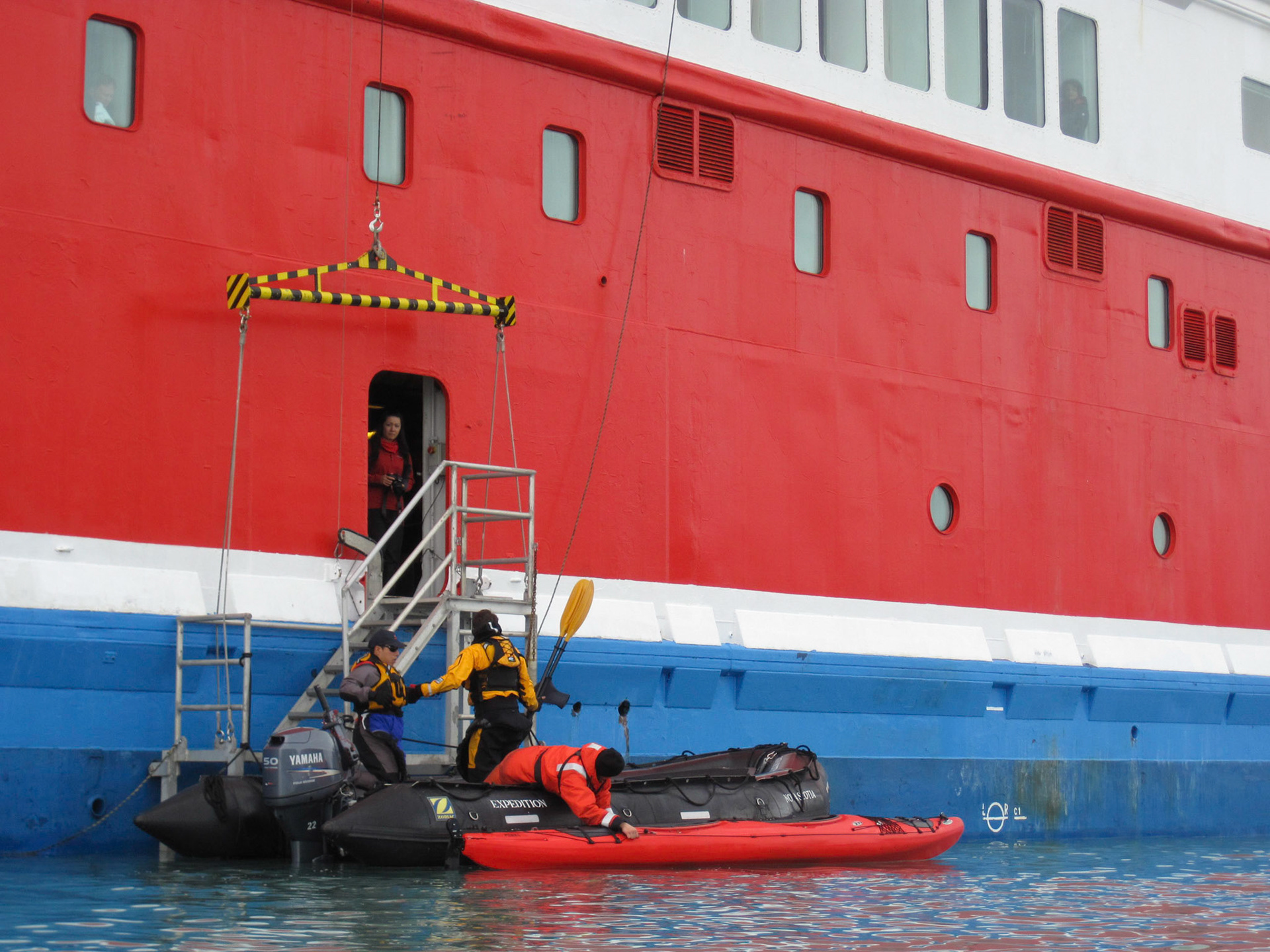 Getting into the kayak from a zodiac