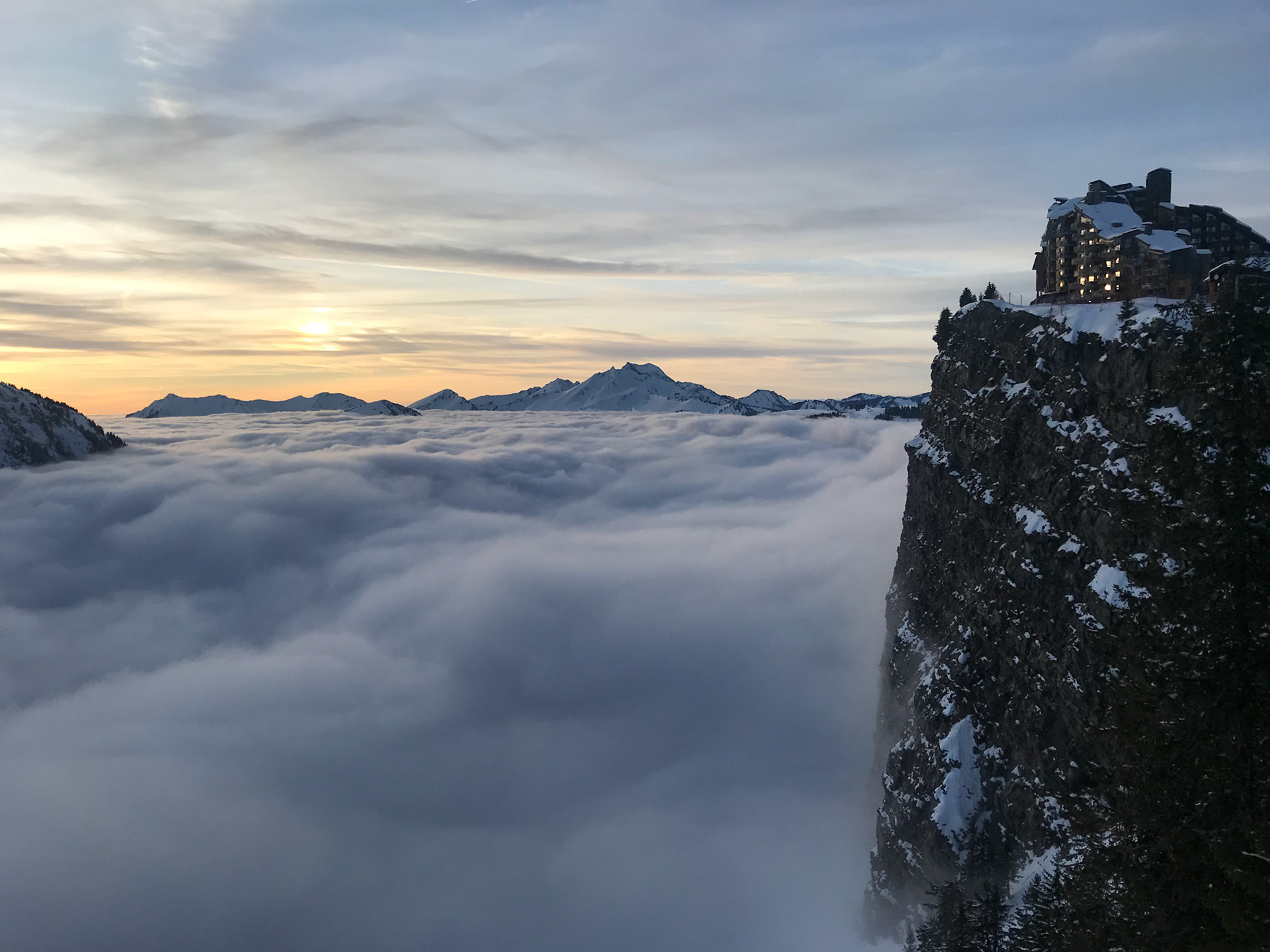 Cliff at Avoriaz and clouds in the valley