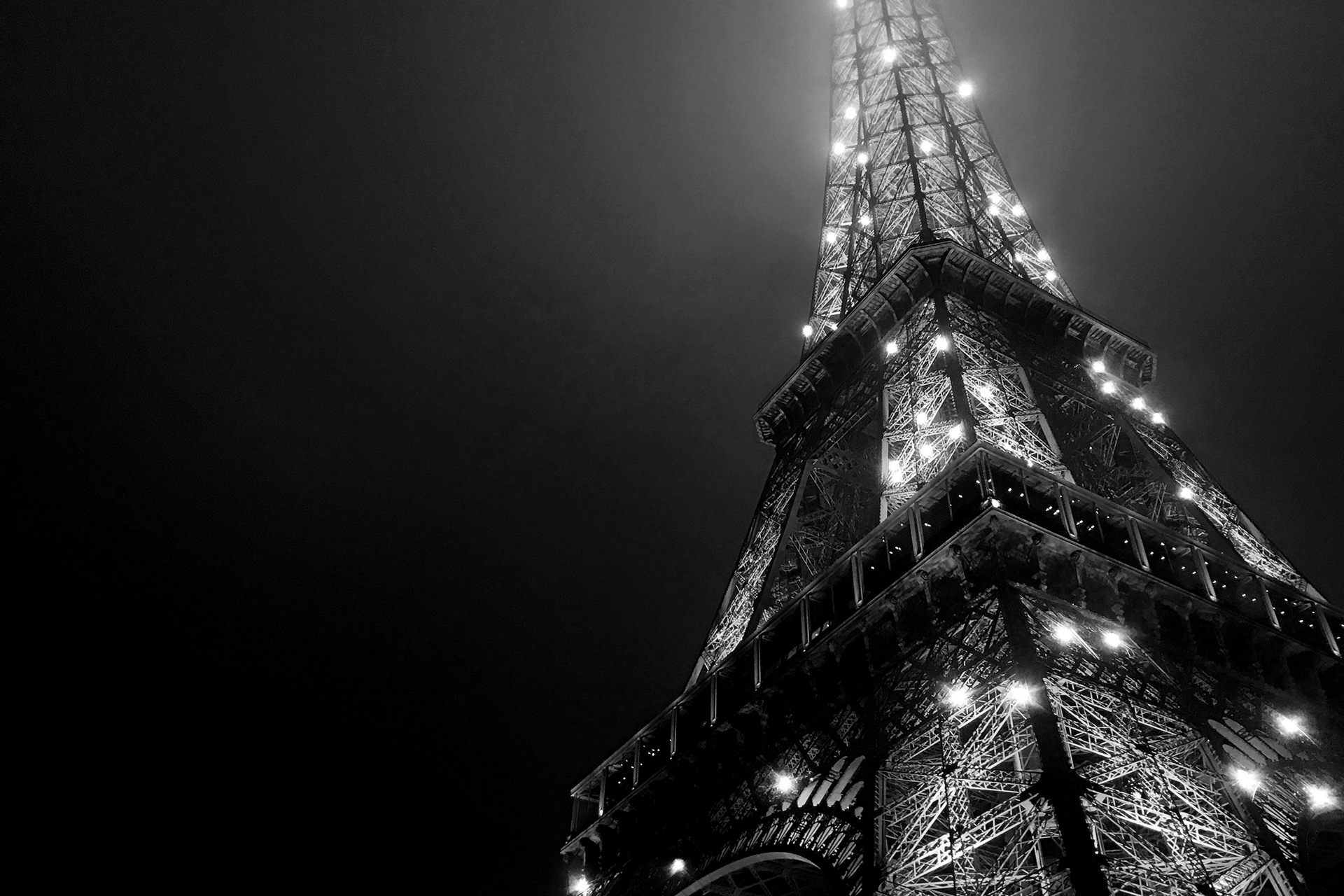 Photo of the Eiffel Tower lit up at night