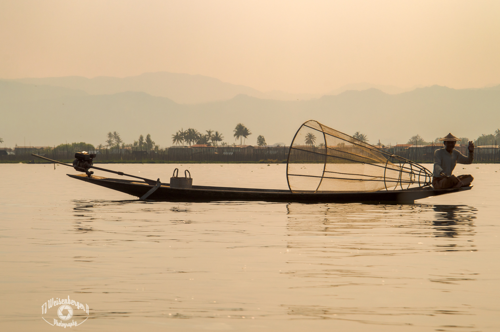 Intha, Traditional Basket Fishermen of Inle Lake - Burma Myanmar; Asia; Basket; Boat; Boats; Burma; Burmese; Canoe; Environment; Famous Place; Fishermen; Inle; Inle Lake; Intha; Intha Fishermen; Lake; Landscape; Landscape - Scenery; Longtail; Mountain; Net; People; Photography; Planet Earth; Scenics - Nature; Skiff; Southeast Asia; Spring; Sunny; Sunset; Tourism; Tradition; Traditional; Travel; Travel Destinations; Water; fisherman; inya lake; labor; myanmar; nature; outdoors; tradesman; work; working; T.J.; TJ; Weiseberger