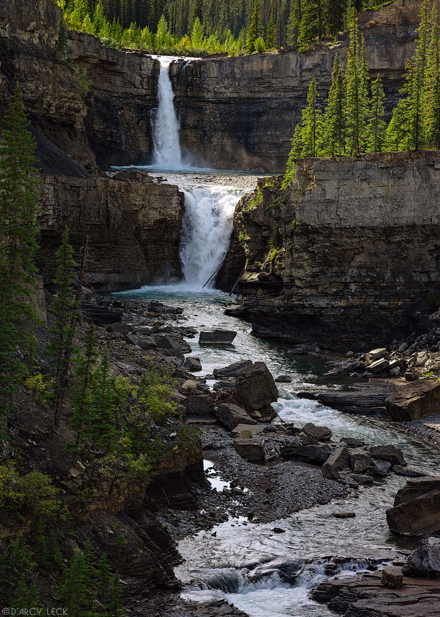 Twin waterfalls form Crescent Falls of the Bighorn River as it plunges into Bighorn Canyon, Alberta, Canada