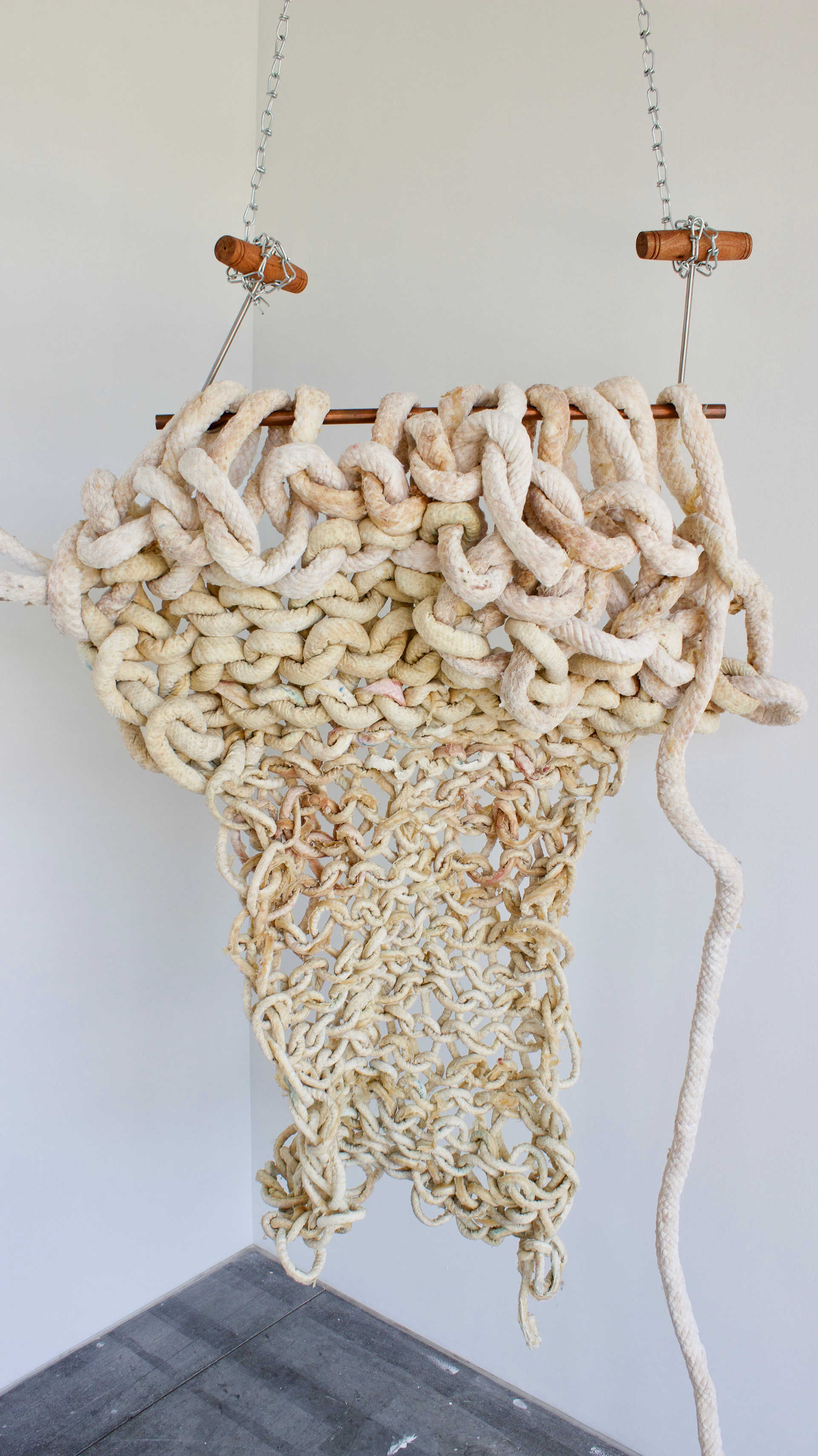 sculptural remnants from an hour and forty minute long performance. Arm knitting latex cord