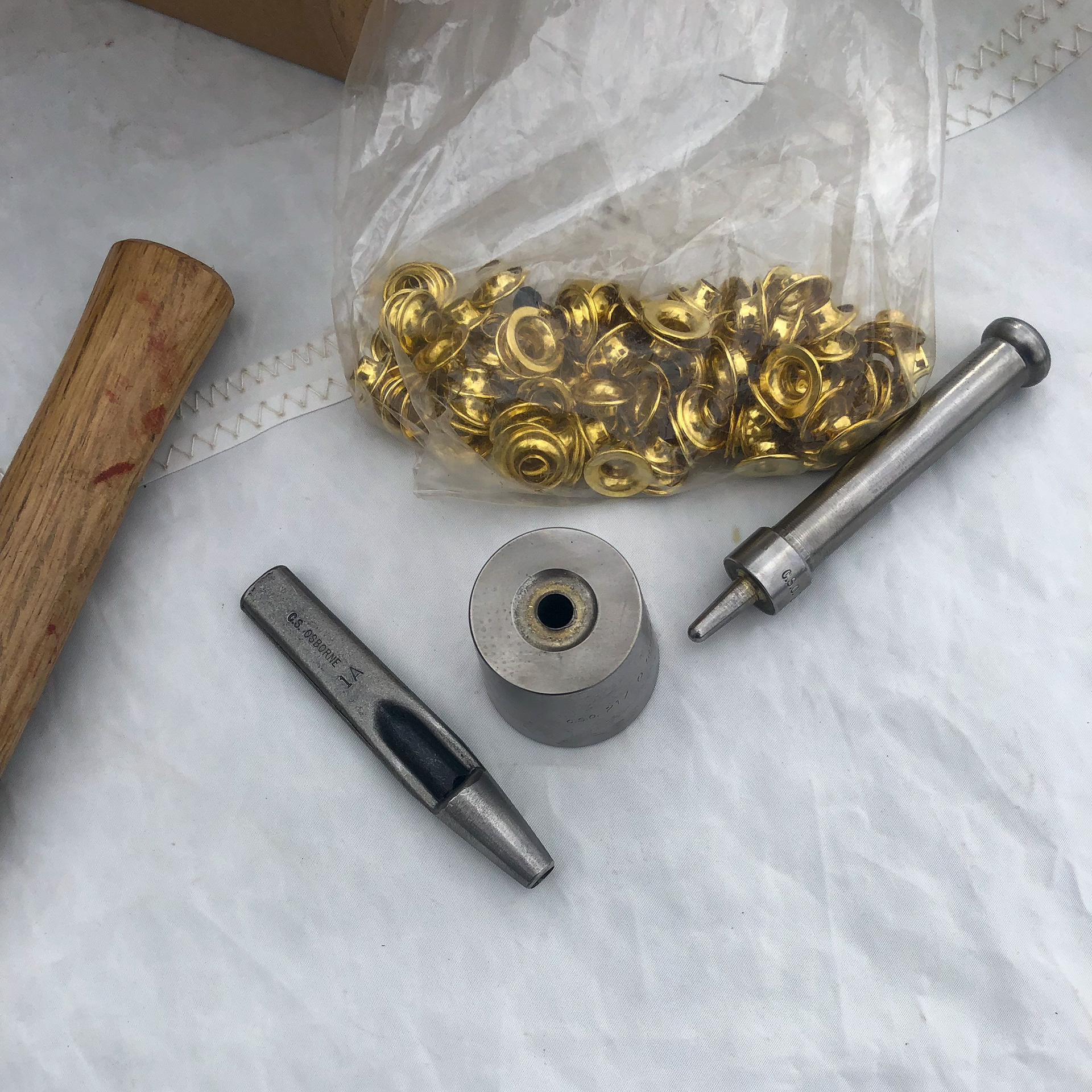 Punching extra grommets
