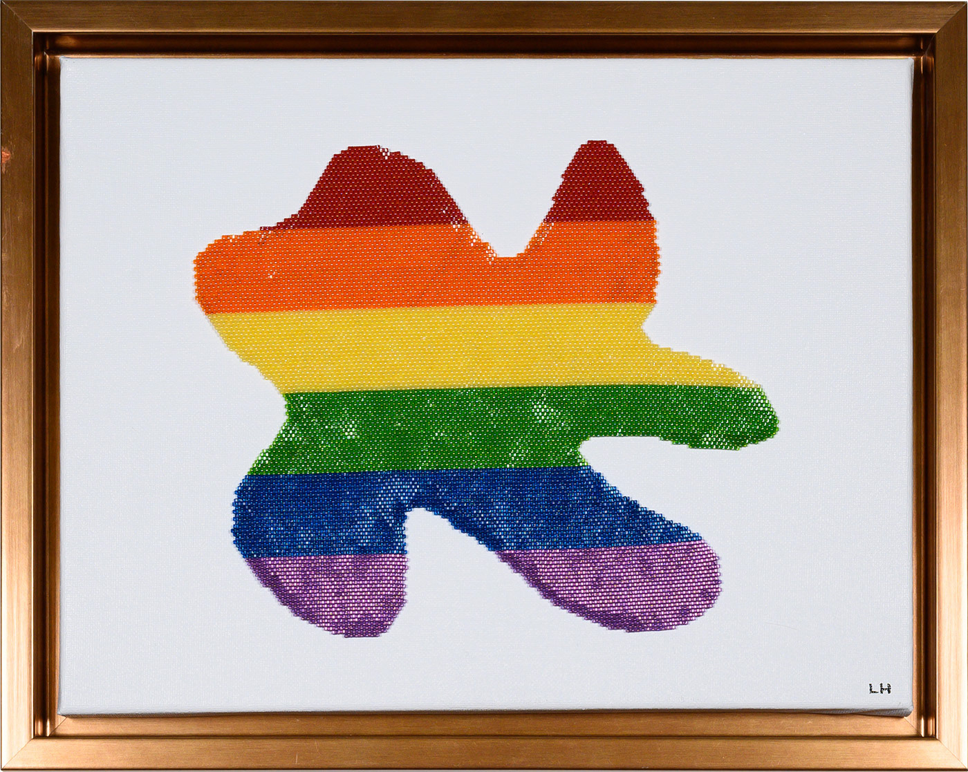 Copper coloured frame, white canvas background. A splat (random shape in the shape as is a droplet has hit the floor) made by handwoven Toho Aiko beads in the colours of the LGBT flag, red, orange, yellow, green, blue and purple. The beads are lustred