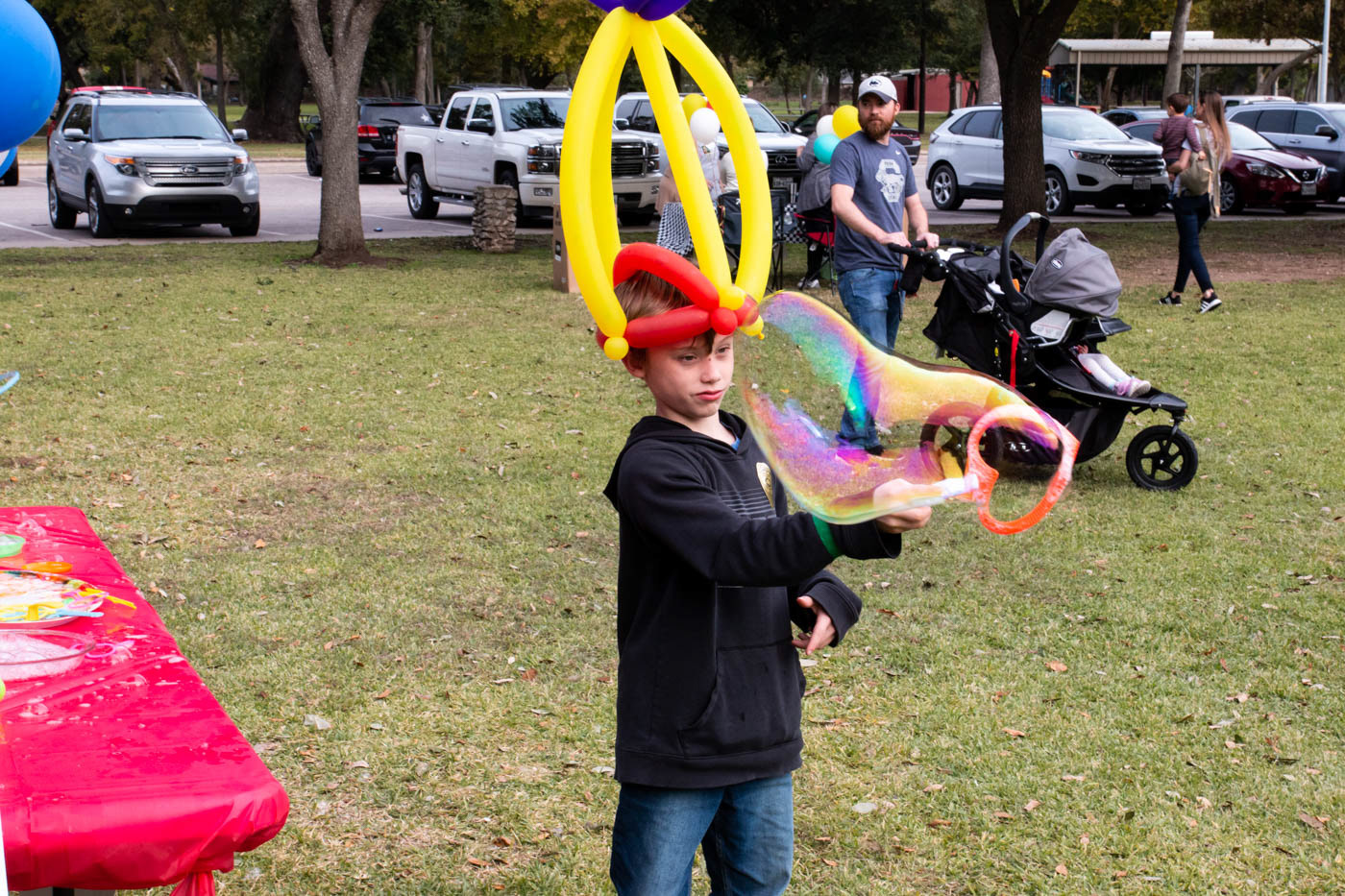 William Worcester, age 9, from Angleton plays at the bubble stand at the Teddy Bear Carnival on November 17, 2019 at Clute Municipal Park.