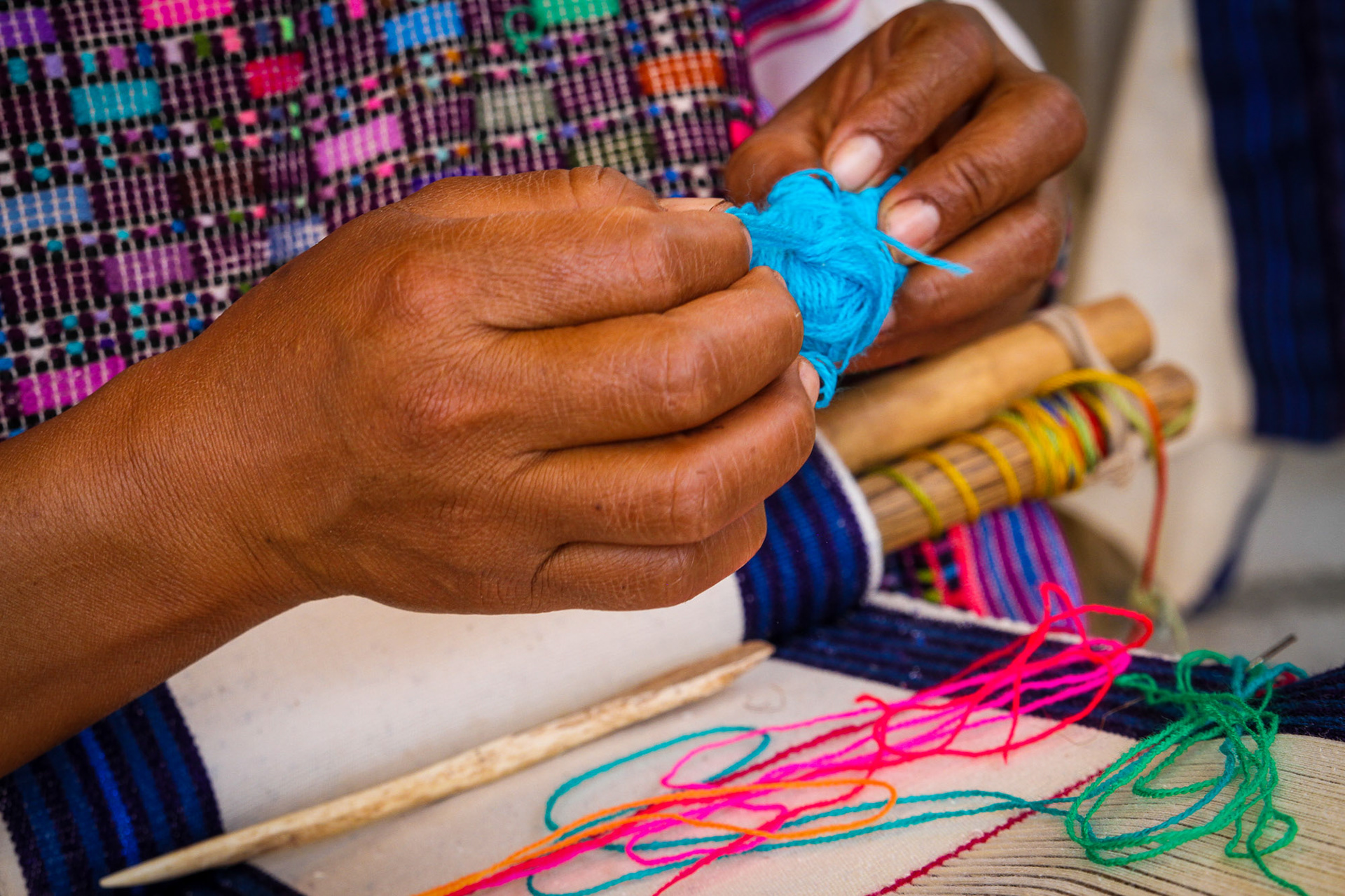 Selecting colors for her weavings.
