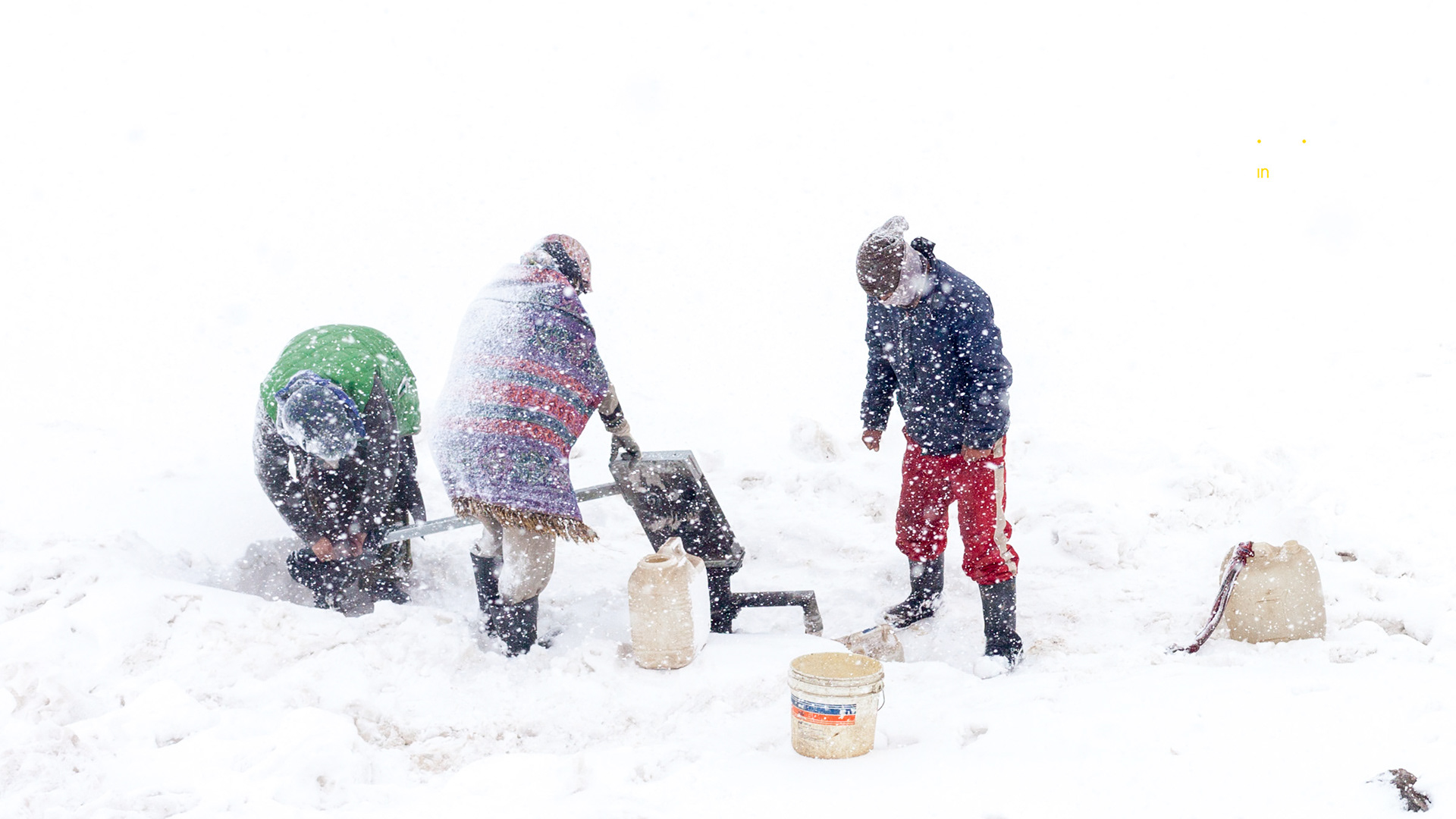 Collecting water during a snow storm.