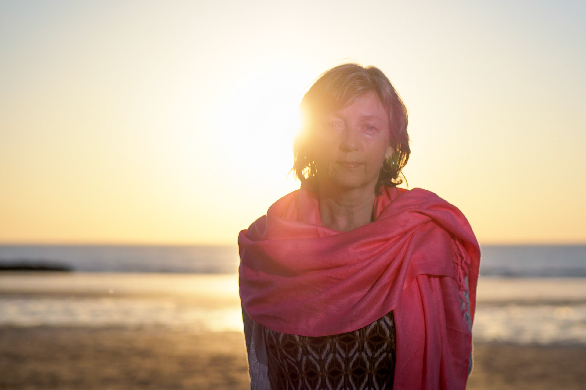 Adult female with pink scarf on the beach I