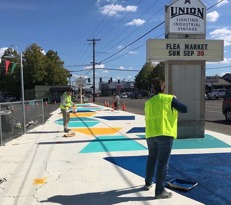 Process of painting Ellen Picken's street mural in Beaverton, Oregon