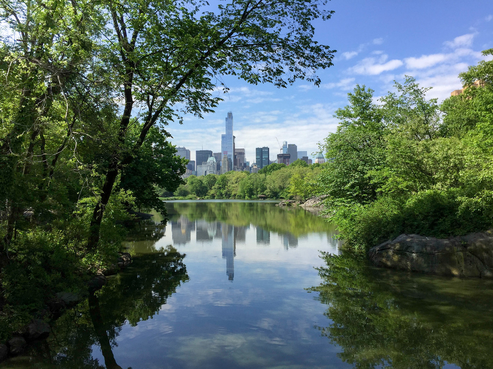 View of Central Park South reflected in Central Park Lake