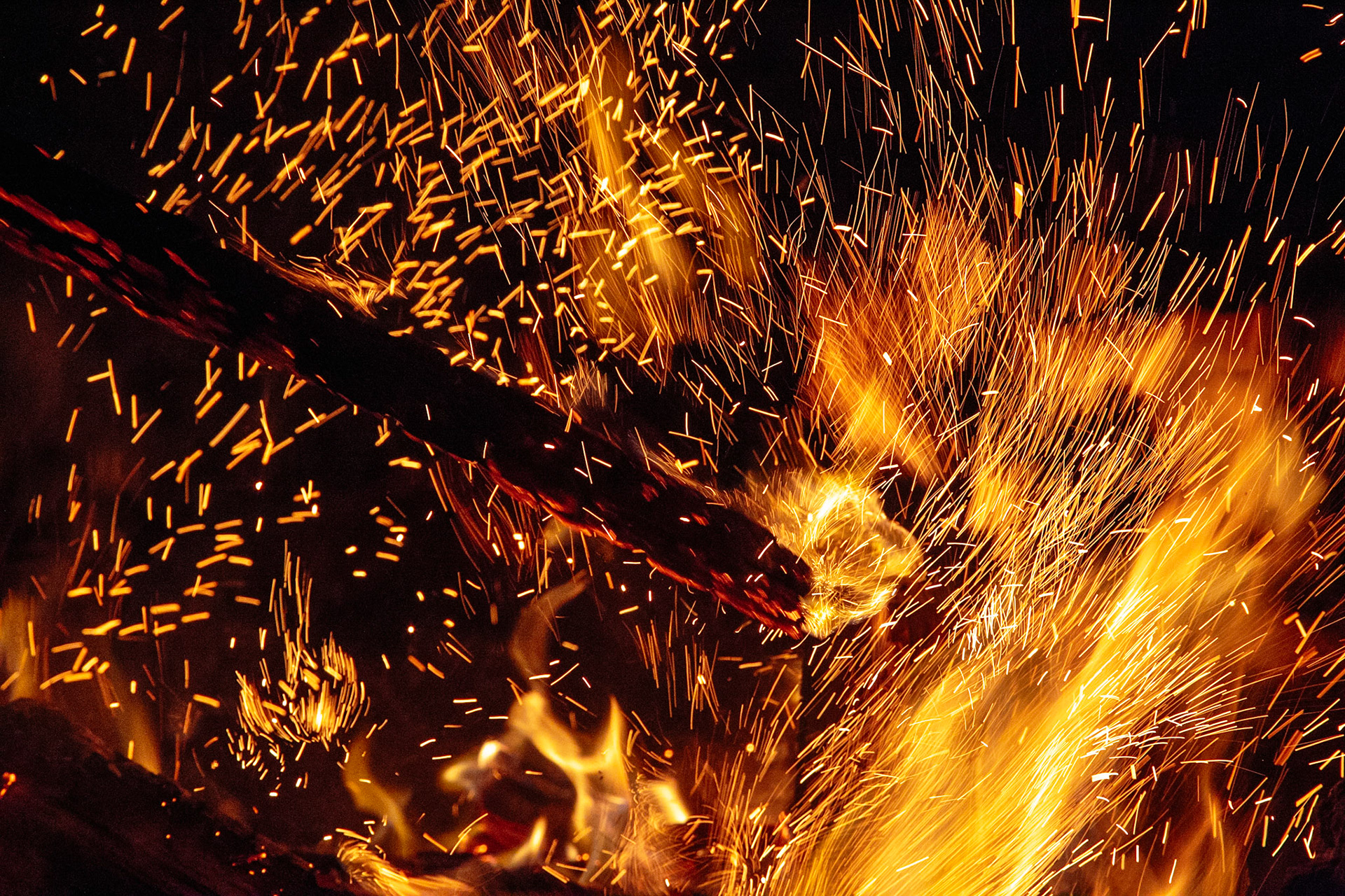 There is something hypnotic about the beauty of red-orange flames, especially when they burn in the night. This print showcases the fierce energy of fire. Flames and sparks illuminate the darkness, as they are stoked by a branch held by an unseen hand. This print is based on a digital photograph by Toby Malek. Toby studied Media Arts in Austria and he’s a gifted photographer and painter. He uses his years of education and experience to take pictures that feature thoughtful composition, vibrant color and intriguing elements. When you choose this print, you may have it printed on archival canvas or illustrious paper. Our archival canvas prints last for over a century and offer textural appeal for a 3D effect. Our archival paper prints offer amazing colour gamuts and they are printed with archival inks that are free of chlorine, acid and lignin. Once you’ve chosen your preferred material, we’ll get your print ready. This fiery print is an ideal choice for adding intensity and edge to a home or office interior. It celebrates nature in a way that is unique and fascinating. If you’re drawn to the beauty of licking flames and glowing sparks, this print is right for you.