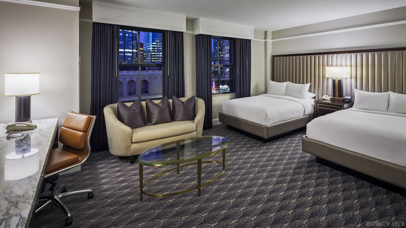 hotel photographer D'Arcy Leck photographs a guest room of the Hilton President Kansas City hotel
