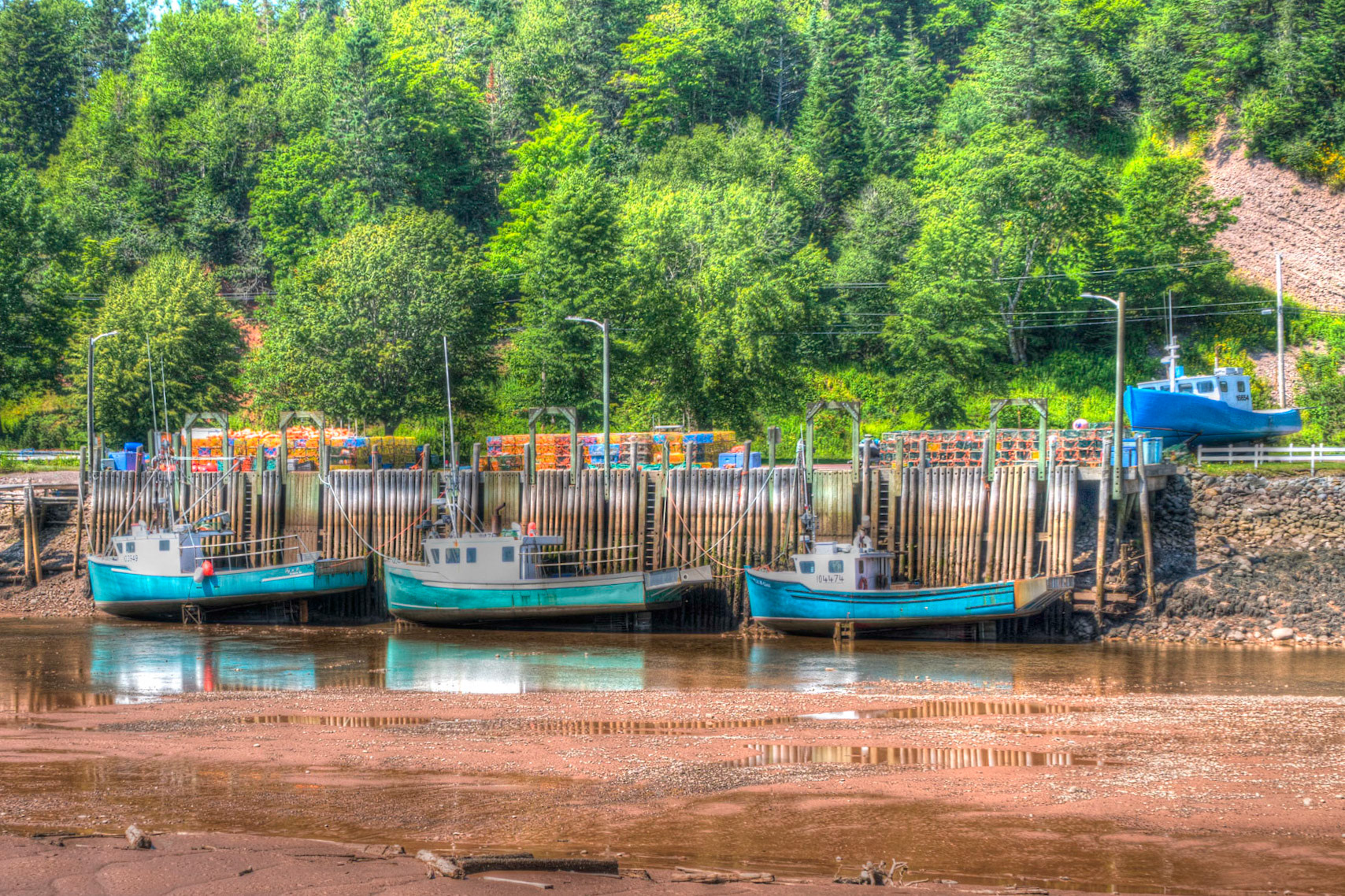 Boats at low tide in the harbour at St Martins
